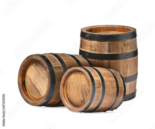 Set of many wooden barrels on white background