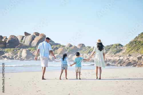 Back, holding hands and a family at the beach for walking, bonding and on a vacation in summer. Care, nature and parents and children with affection while on a walk by the sea during a holiday