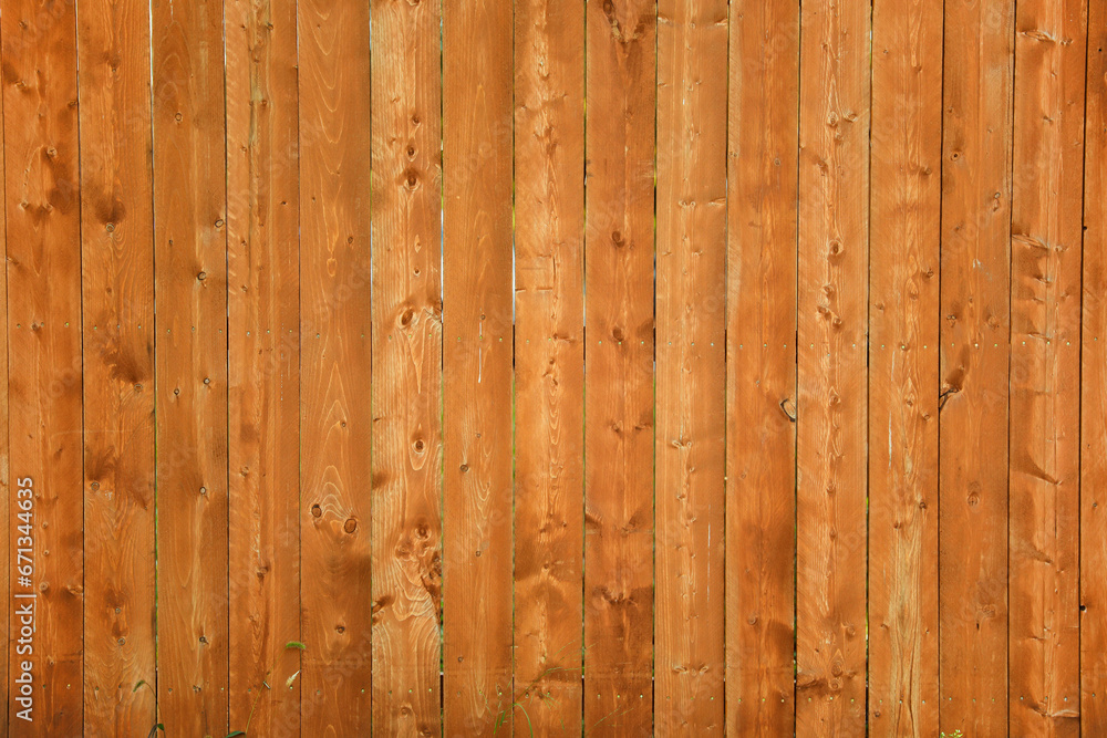 wooden fence stands tall, weathered by time, a symbol of protection and boundaries. Warm sunlight enhances its rustic charm in a serene garden setting wooden fence stands tall, weathered by time, a symbol of protection and boundaries. Warm sunlight enhances its rustic charm in a serene garden setting