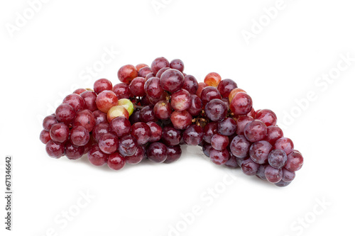 Red grapes (vitis vinifera) isolated on white background.