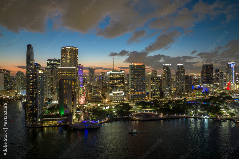 Fototapeta premium Night urban landscape of downtown district of Miami Brickell in Florida, USA. Skyline with brightly illuminated high skyscraper buildings in modern american megapolis