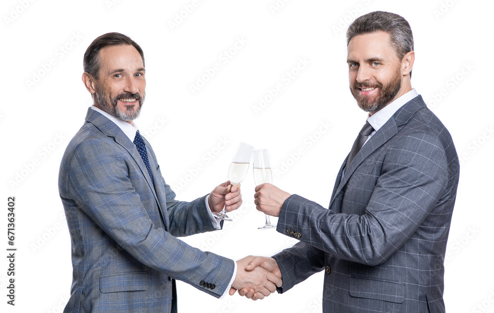 partnership concept. celebrate business deal. two businessmen handshaking after contract deal with champagne. successful agreement in business deal. businessmen dealing isolated on white. cheers partnership concept. celebrate business deal. two businessmen handshaking after contract deal with champagne. successful agreement in business deal. businessmen dealing isolated on white. cheers