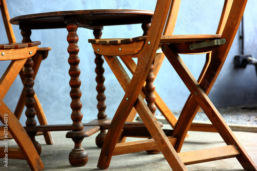 wooden chairs table retro style  decoration in the corner . close up old hand craft furniture imitated design in home