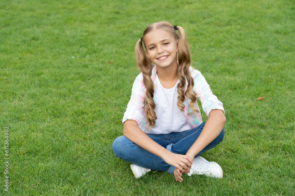 childhood lifestyle of teen. relax on summer lawn. girl relax peacefully on the grass. happy childhood of teen girl. summer relax in park. teen girl sitting outdoor. freedom and joy childhood lifestyle of teen. relax on summer lawn. girl relax peacefully on the grass. happy childhood of teen girl. summer relax in park. teen girl sitting outdoor. freedom and joy