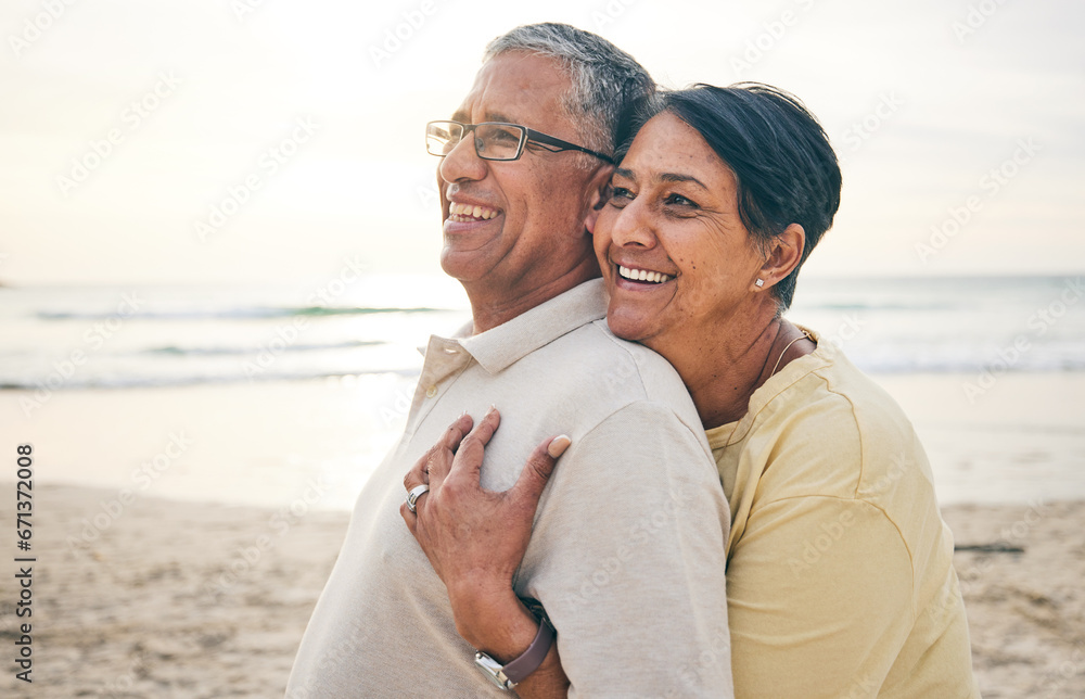 Obraz premium Love, hug and senior couple at beach happy, relax and bond in nature together. Ocean, embrace and old people hugging at the sea for travel, vacation and enjoy retirement with holiday, freedom or trip
