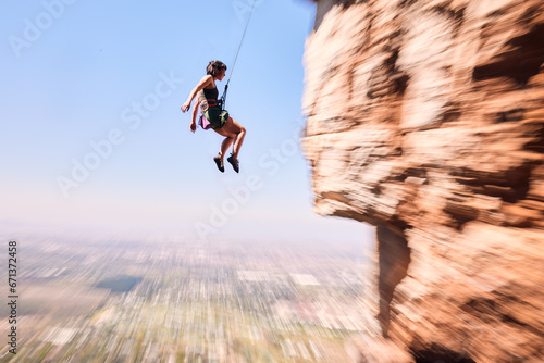 Sports  rock climbing and jump with woman on mountain for fitness  adventure and challenge. Fearless  workout and hiking with person training on cliff for travel  freedom and exercise mockup