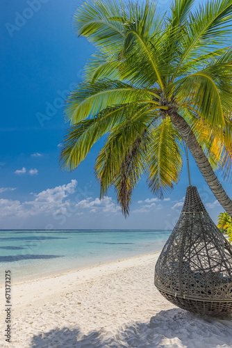Tropical couples beach background as summer landscape swing or hammock and sunny white sand calm sea. Carefree scene best vacation honeymoon destination. Vertical panoramic paradise island coast