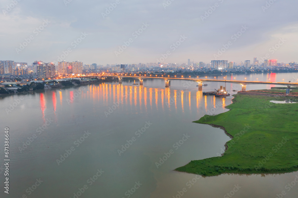 Vinh Tuy bridge crossing Red river in Hanoi during twilight Vinh Tuy bridge crossing Red river in Hanoi during twilight