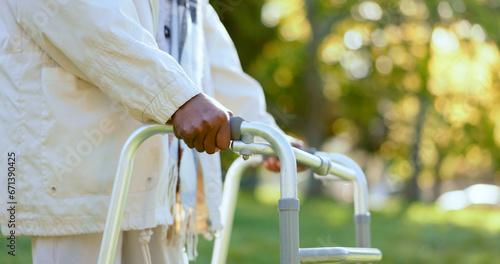 Hands, walking frame and a senior person in a garden outdoor in summer closeup during retirement. Wellness, rehabilitation or recovery and an elderly adult with a disability in the park for peace