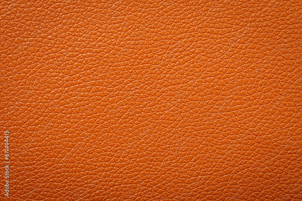 Fototapeta premium Synthetic leather brown background texture. Brown leather textured background.