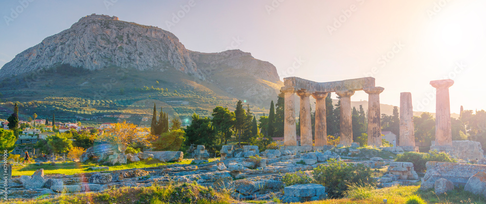 Naklejka premium Ruins of temple of Apollo at sunset, Ancient Corinth in Greece