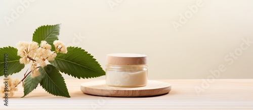 Natural cosmetics concept with cream jar horse chestnut leaf and flowers on wooden stand photo