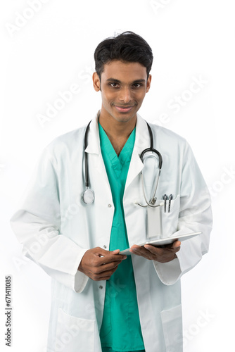 Portrait of a male Indian doctor wearing a white lab coat