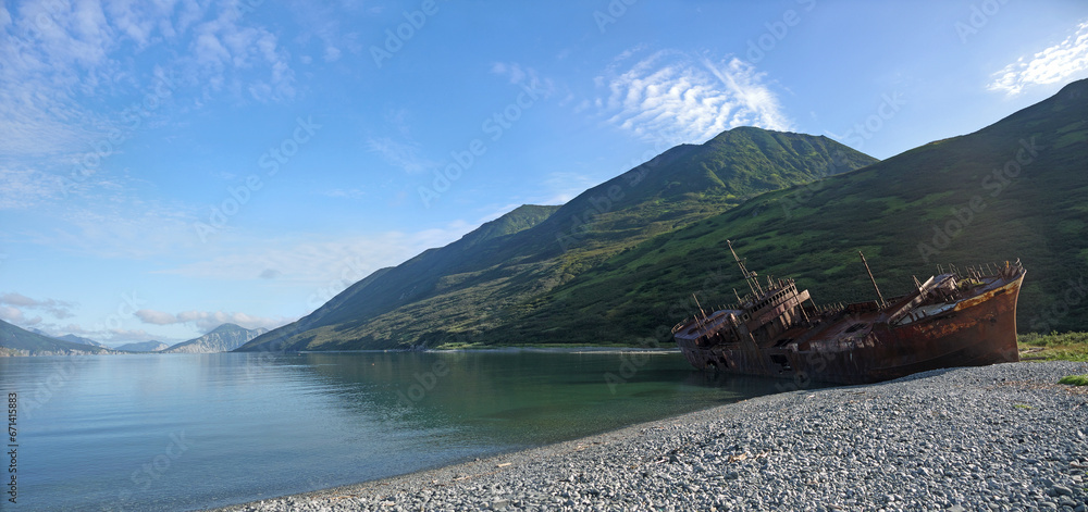 Shipwreck site in small bay, Old rusty whaling ship on the sea shore, Kamchatka, Morzhovaya bay - obrazy, fototapety, plakaty 