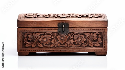 A vintage wooden box with ornate carvings, its rich texture highlighted against a pure white backdrop.