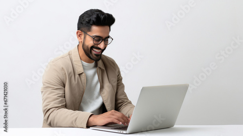 young indian man using laptop