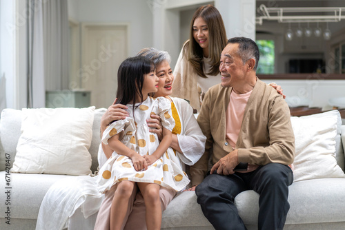 Portrait of happy love family asian mother playing with adorable asian kid girl.daughter, care, insurance.Happy family moments good time love with grandparents.Love of big family
