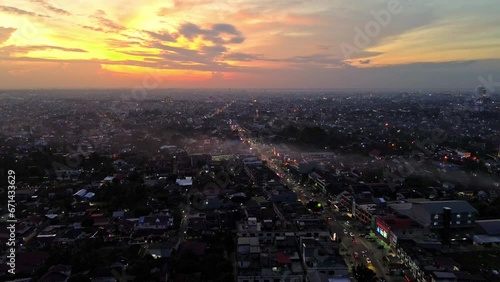 Wallpaper Mural Aerial 4k video of Pekanbaru city during sunset. The capital city of Riau province with many residential buildings. Torontodigital.ca