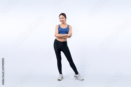 Full body asian woman in sportswear portrait, smiling and posing cheerful gesture. Workout training with attractive girl engage in her pursuit of healthy lifestyle. Isolated background Vigorous © Summit Art Creations