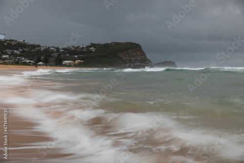 Seascape featuring an ocean with powerful waves crashing against a shore. Wollongong, Australia