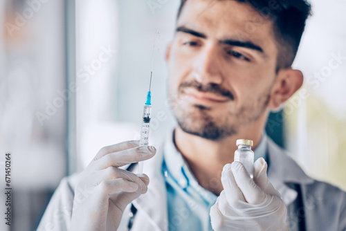 Man, doctor and syringe with vial for cure, healthcare or medication for injection at the hospital. Male person or medical professional holding needle for dose, diagnosis or drugs at the clinic