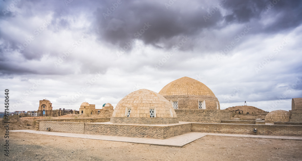 Ancient Muslim cemetery Mizdakhan with a centuries-old history on a hill in Uzbekistan with mausoleums and burials