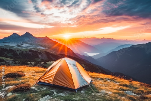 Camping tent surrounded by stunning nature in the mountains with beautiful sunset in the background, nature lover, adventure camping © VisualProduction