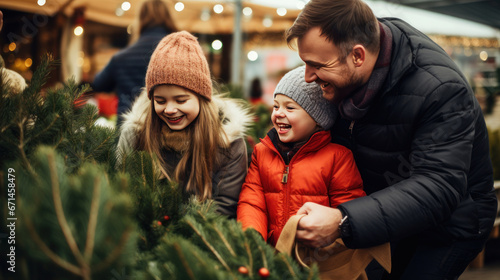 A happy family with a child with Down syndrome and parents choose a New Year's tree at the Christmas tree market. Merry Christmas and Merry New Year concept.