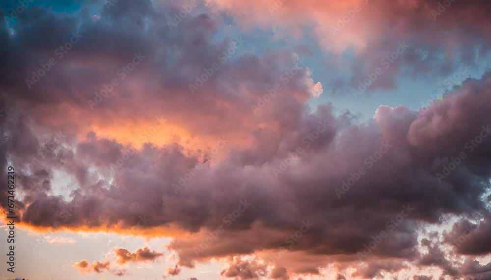 Toned dramatic sky background. Blue gray sky with orange pink clouds. Cloudscape. Fantastic sunset.