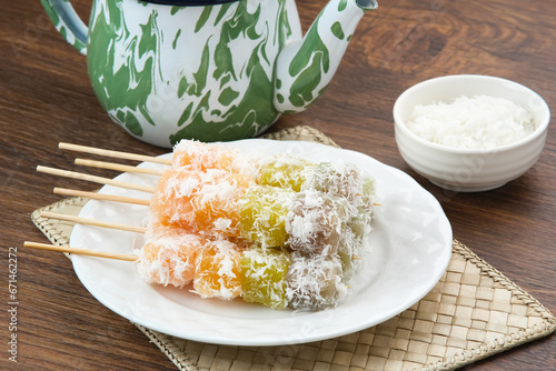 Sentiling or ongol-ongol, Indonesian traditional snack, made from cassava sprinkled with grated coconut
 photo