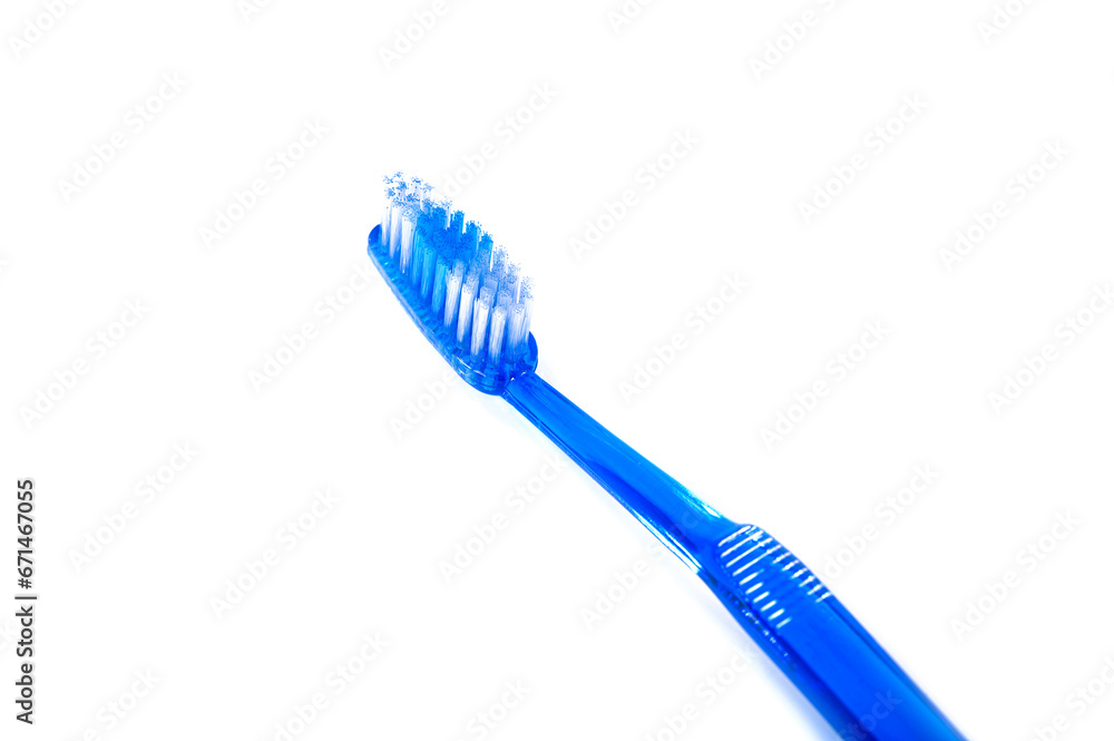 blue plastic toothbrush isolated on white background blue plastic toothbrush isolated on white background
