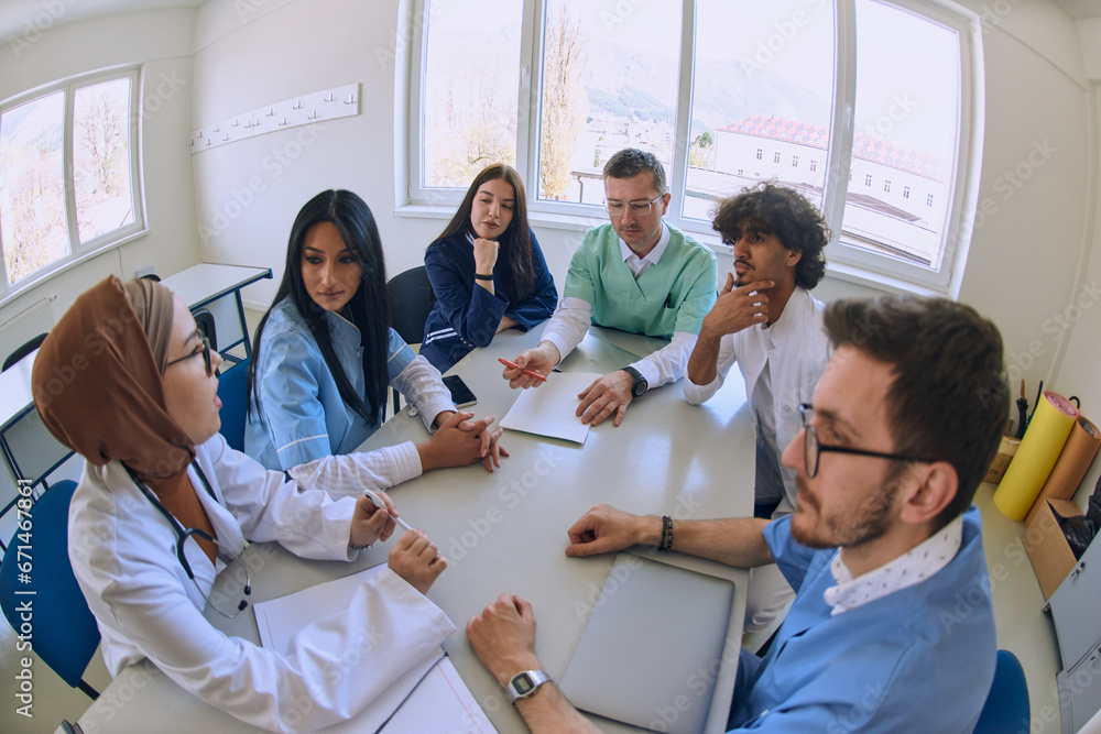 Fototapeta premium A dedicated group of doctors and medical nurses attentively listens to their colleague's work plan in a healthcare facility, fostering collaboration and ensuring high-quality patient care