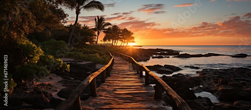 Panorama view of footbridge to beach at sunrise photo