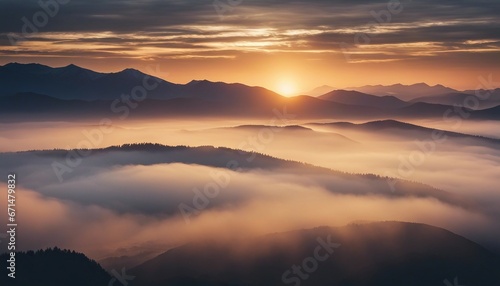 view of misty mountain layers and sunset from a high hill