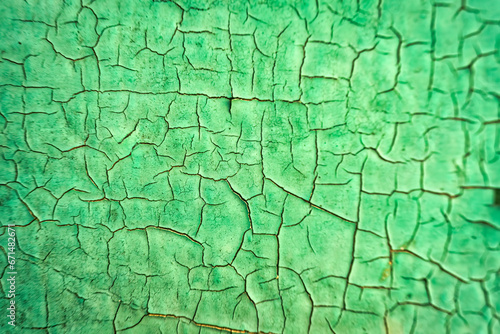 Weathered cracked green iron metallic with rusted background