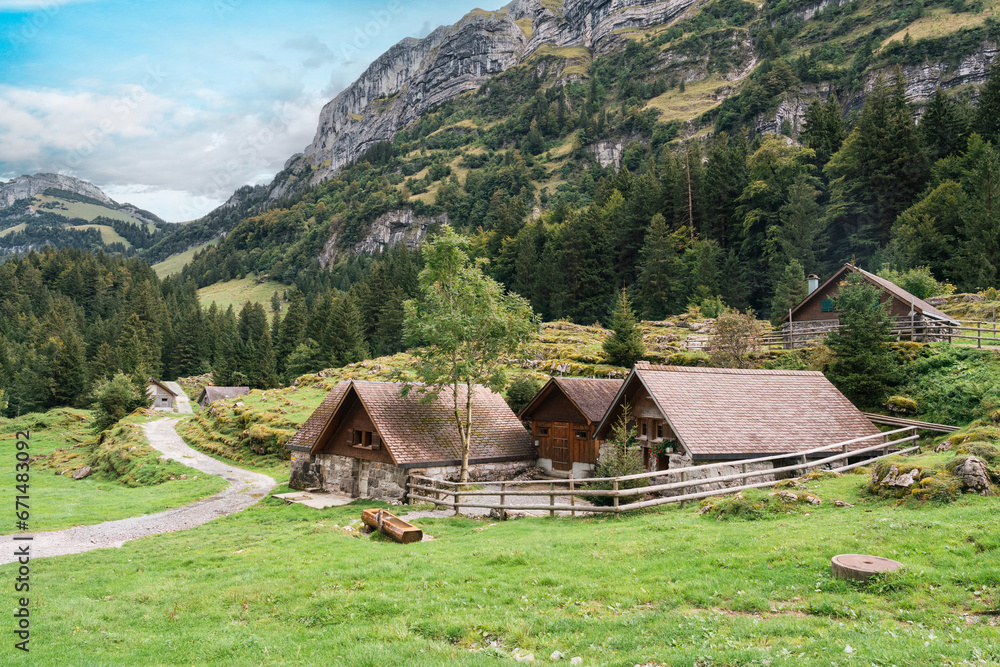 Rustic village in Alpstein mountain range between trail to Seealpsee lake during summer at Appenzell, Switzerland
