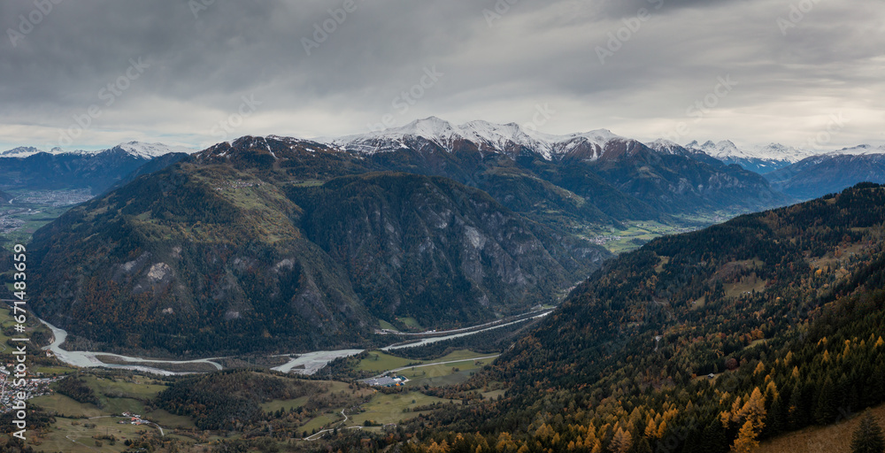 mountain landscape with the Rhine river in the Swiss Alps in late autumn