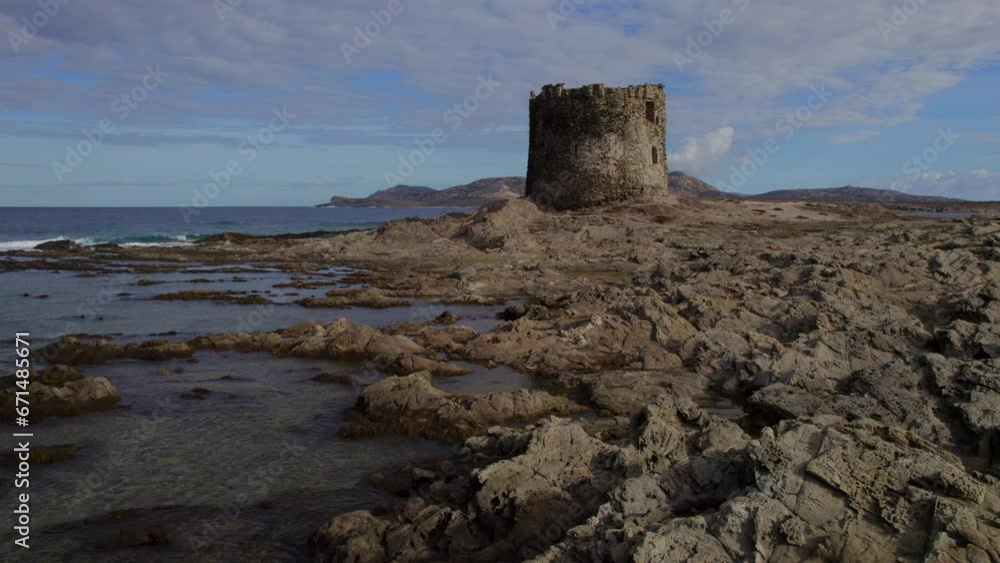 Isola della pelosa, Sardinia: aerial view at low altitude and around the tower that is located on the site. Isola della pelosa, Sardinia: aerial view at low altitude and around the tower that is located on the site.