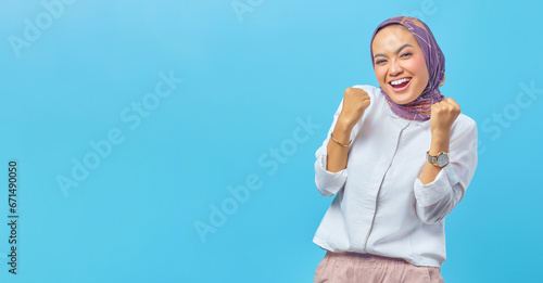 Young amazed Asian woman with successful expression