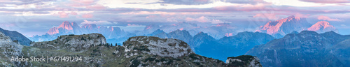 View of pink mountain peaks at sunrise from Falzarego pass  South Tyrol  Dolomites  Italy
