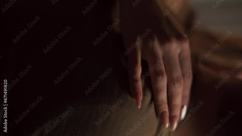 Woman holding male shoulder and kissing, close-up. Focus on woman hand lying on male shoulders, no face. Love relationship Woman holding male shoulder and kissing, close-up. Focus on woman hand lying on male shoulders, no face. Love relationship