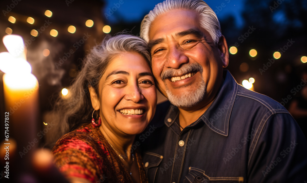 Joyful Senior Mexican Couple Capturing a Selfie at a Fiesta