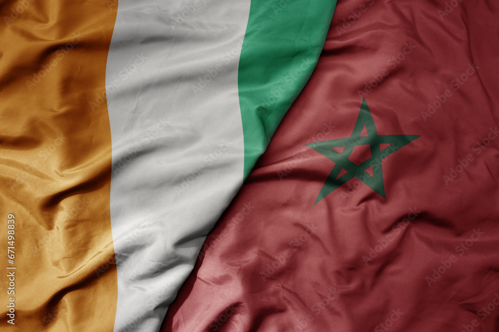 big waving national colorful flag of cote divoire and national flag of morocco . big waving national colorful flag of cote divoire and national flag of morocco .