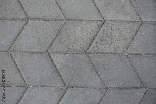 Close shot of gray diamond shaped concrete pavement with geometric pattern