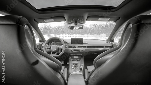 Inside moden car background, luxury car interior elements wallpaper. Black leather car interior © Studio-M