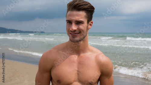 Smiling male model on the beach