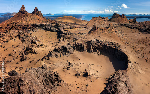 Cinder cones and craters in the ancient volcanic landscape on the island of Bartolome in the Galapagos Islands, Ecuador. photo