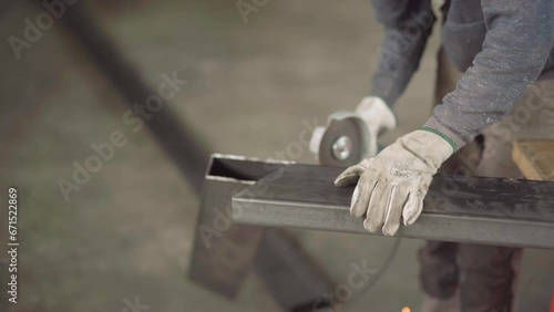 Skilled Worker Using a Grinder for Metal Cutting in Dynamic Poses and Angles, Ready for Action in the Advanced Metallurgical Industry in 4K Quality