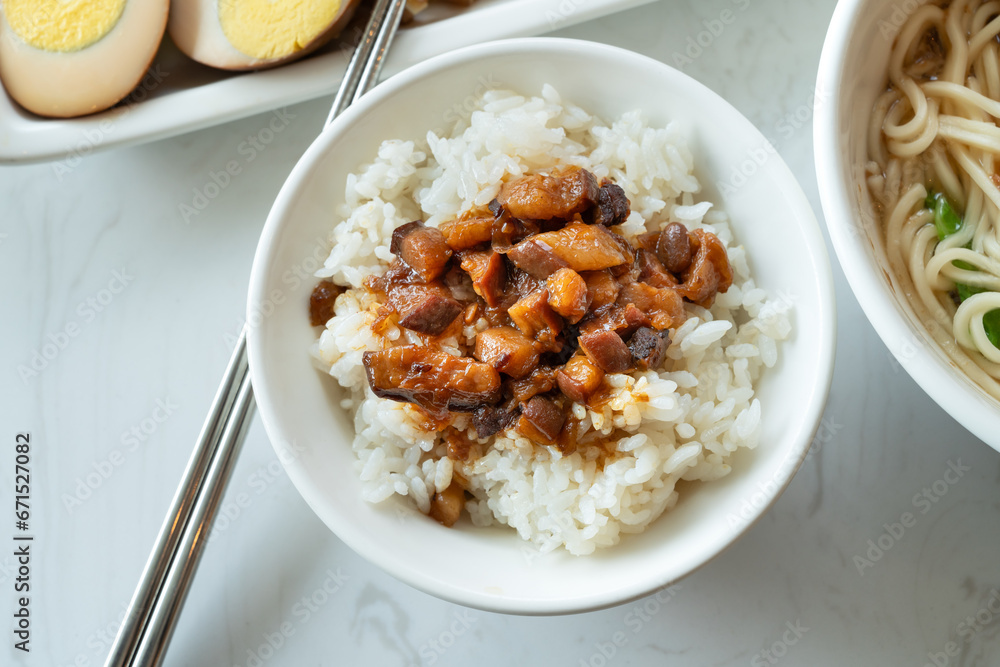 Braised meat over cooked rice, famous and delicious street food in Taiwanese restaurant. Braised meat over cooked rice, famous and delicious street food in Taiwanese restaurant.
