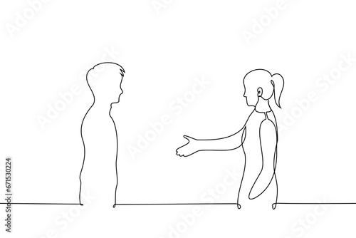 woman and man stand opposite each other, woman extends hand to man - one line art vector. concept to be first to reconcile, acquaintance, proactive woman, offering friendship, acquaintance, mentoring
